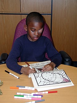 Child wearing an adhesive eyepatch to treat amblyopia (lazy eye)