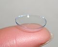 Soft contact lens on fingertip