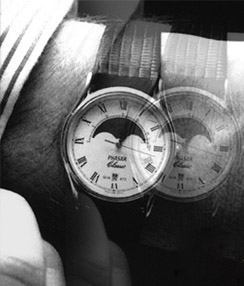 Simulation of double vision showing two overlapping images of the same wristwatch.