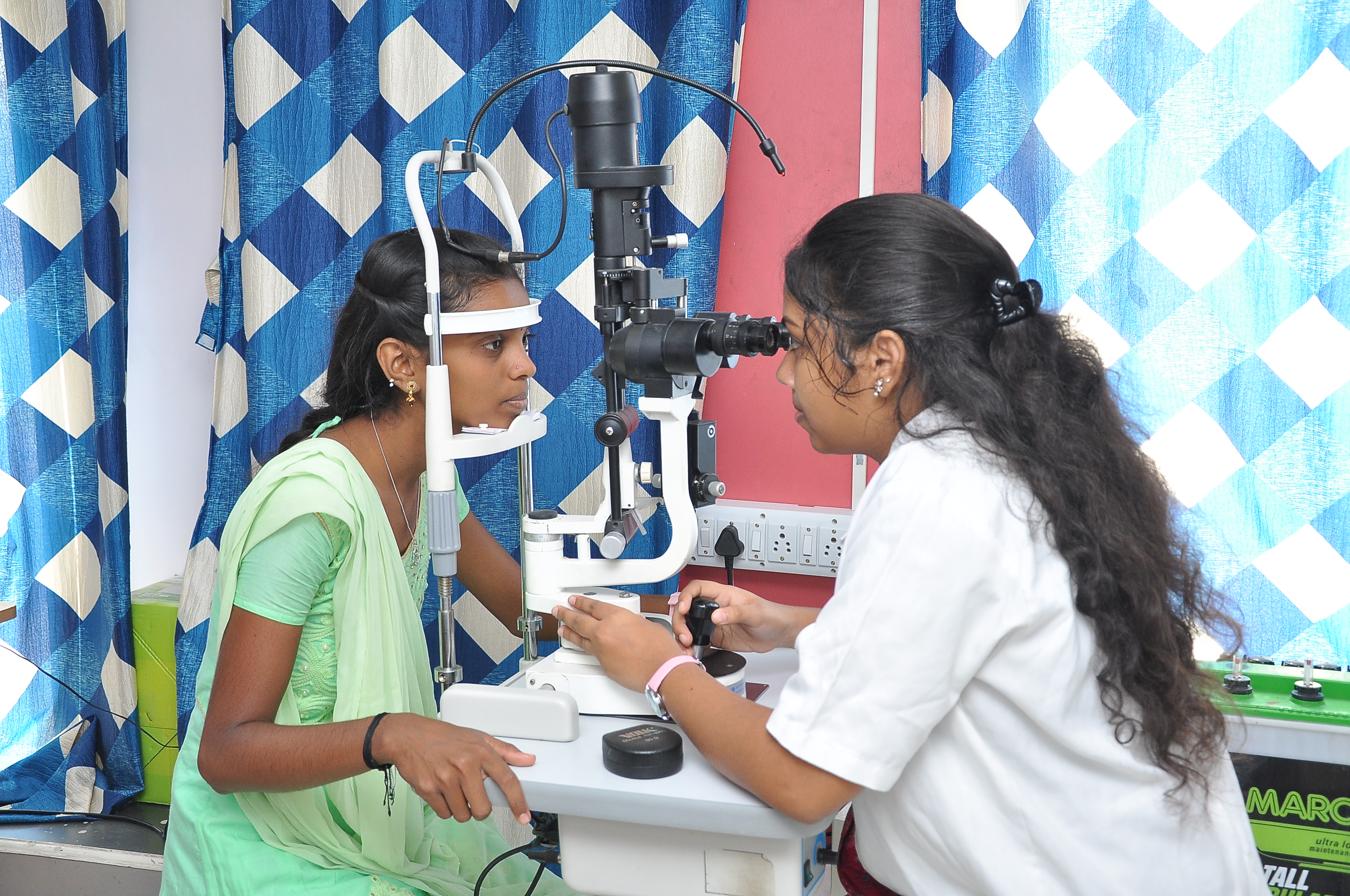 Patient undergoing slit-lamp examination