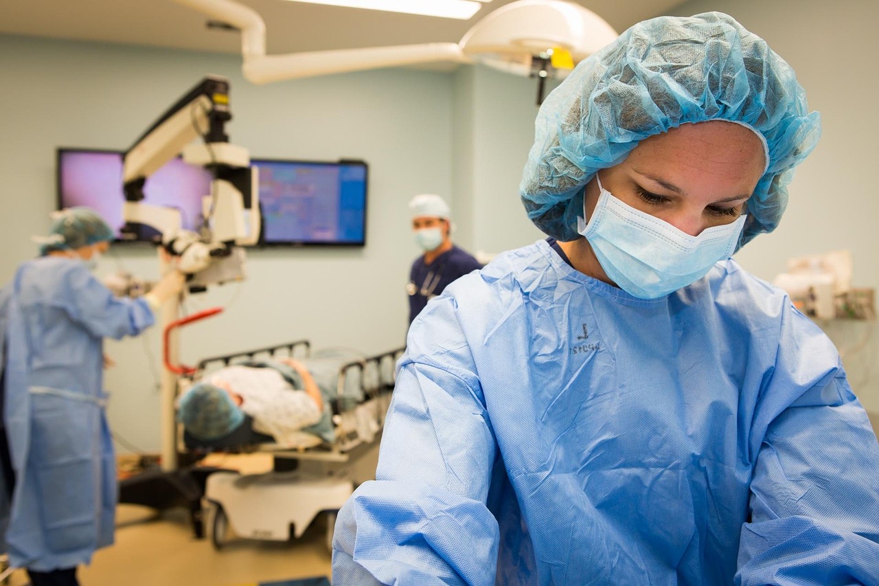 Surgical team performing microscope-guided eye surgery