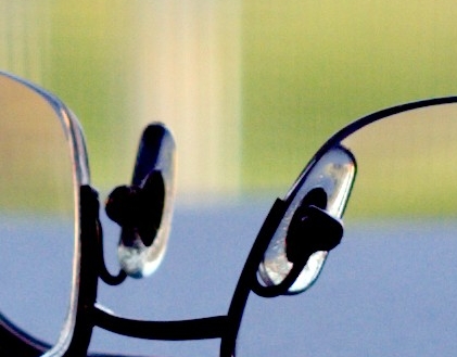 Close-up photograph of the nosepads on a pair of reading glasses