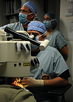 Surgeon performing photorefractive keratectomy with an excimer laser