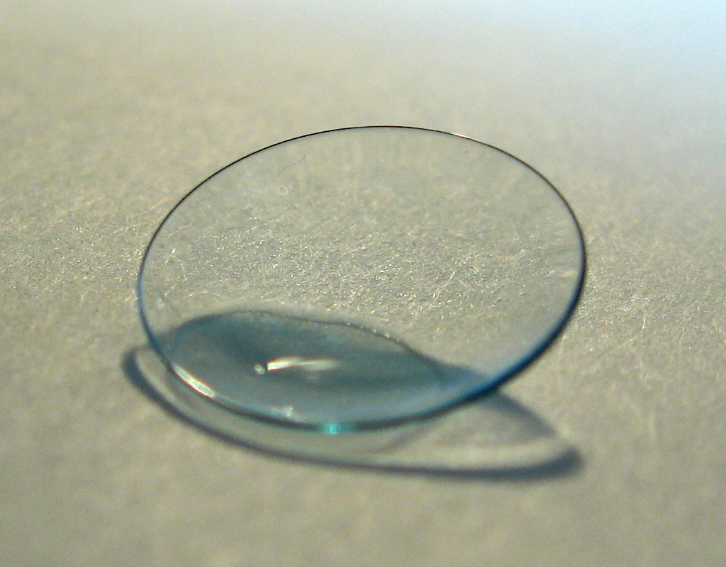Close-up of a soft contact lens on a surface