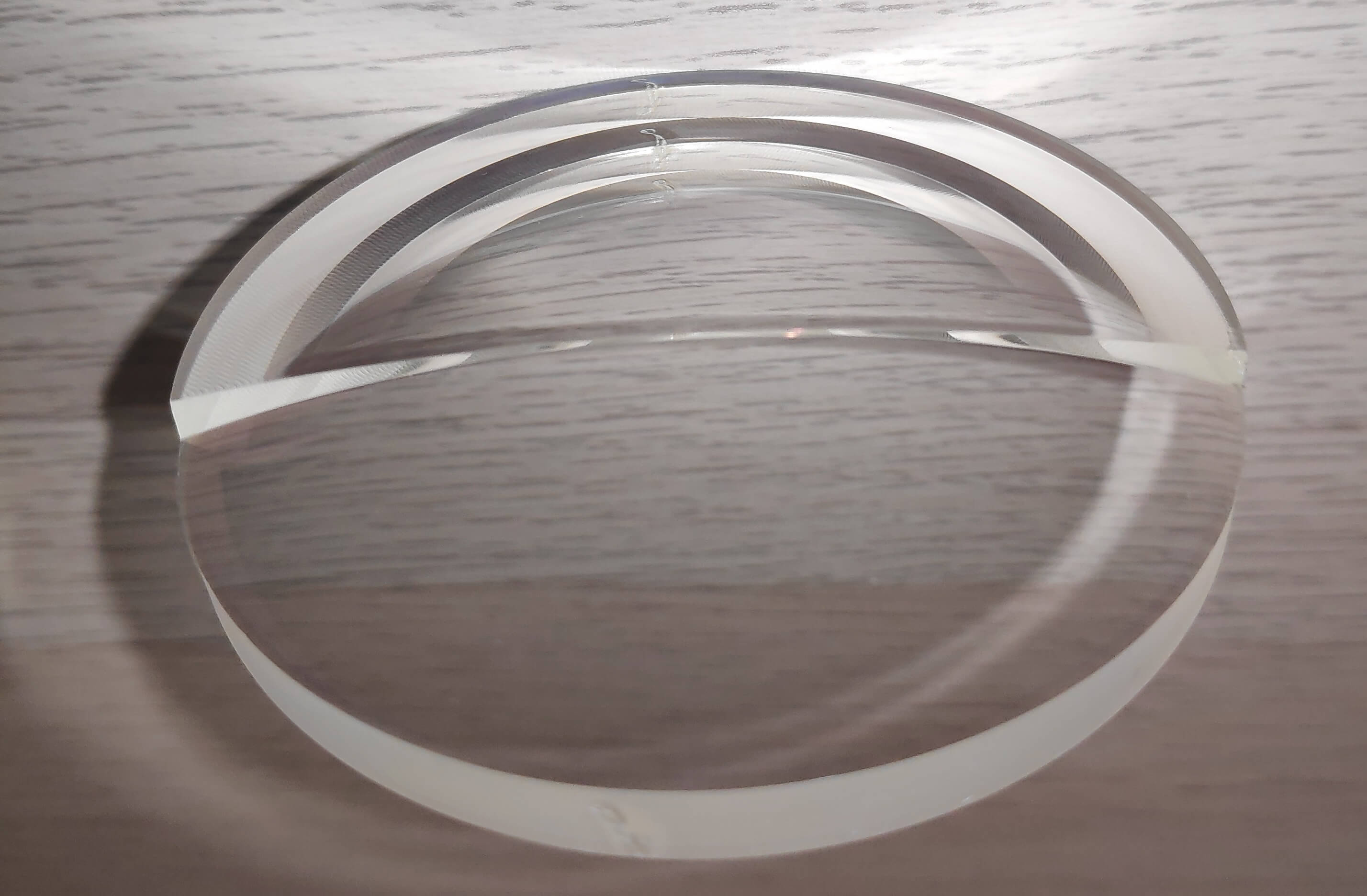 Factory‑cut bifocal lens before edging